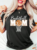 Get ready to cheer on your favorite baller with this Retro Glitter Basketball Mom Oversized Shirt! Perfect for holiday gatherings and gifting, this stylish and quirky shirt will make you the envy of the bleachers. Boldly show off your mom pride in this fun and playful shirt. (Dribble not included.)