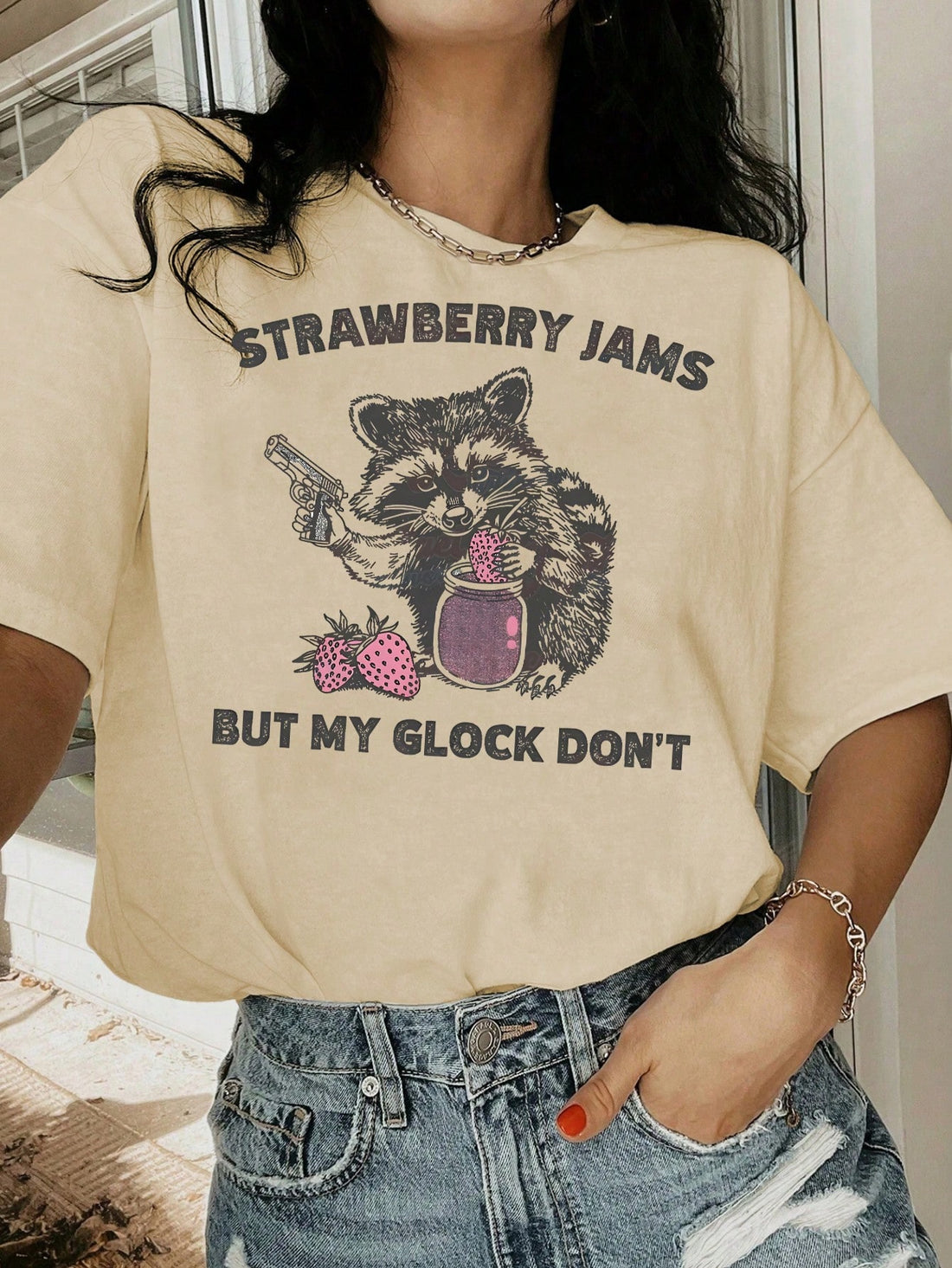 This Retro Strawberry & Raccoon Graphic Tee offers a vintage 90s style with a playful twist. Featuring a unique graphic of a strawberry and raccoon, this casual t-shirt adds a nostalgic touch to any outfit. Made with high-quality materials, it offers both comfort and style. Perfect for any retro enthusiast or casual fashion lover.