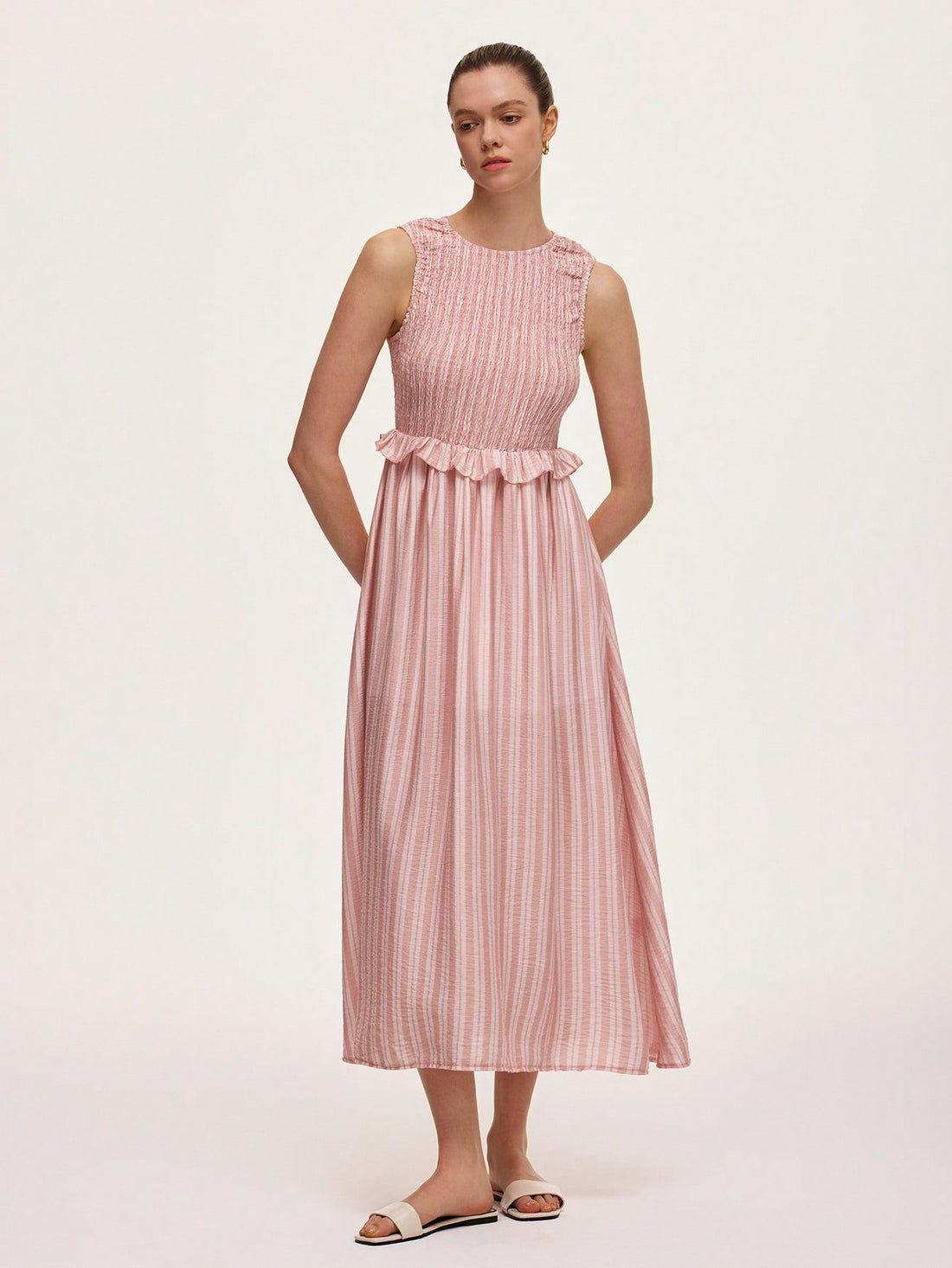 Step into summer fun with this Retro Striped Sleeveless Dress! Featuring playful stripes and a flirty ruffle hem, it’s your go-to for sunny days and holiday adventures. Lightweight and breezy, it keeps you cool while turning heads wherever you go. Perfect for beach strolls, picnics, or casual outings, this dress adds a splash of retro charm to your warm-weather wardrobe.