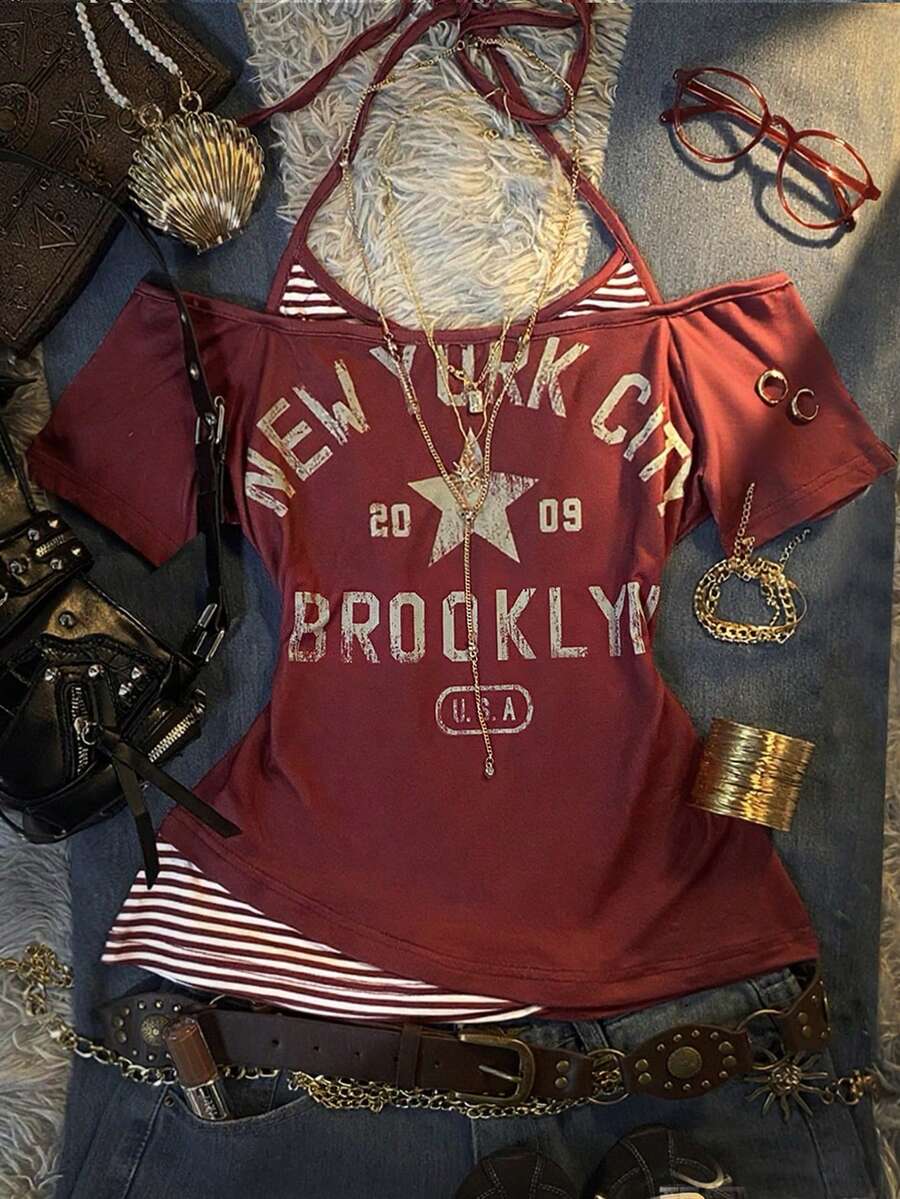 Front flat lay of burgundy layered graphic T-shirt with striped halter insert and New York print