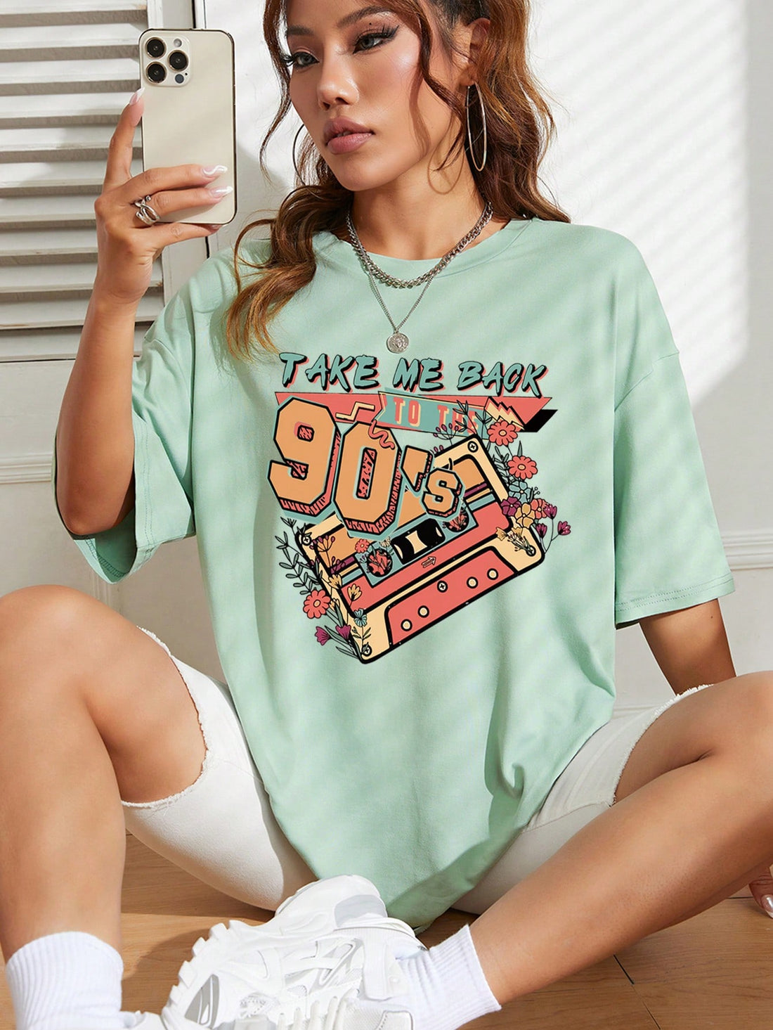 Get ready to turn back time with our Retro Vibes Floral Graphic Tee! With its quirky 'Take Me Back to the 90s' design, this tee is perfect for anyone who loves a good throwback. Made with soft, comfortable fabric, you'll feel stylish and nostalgic all day long. (Outfit goals achieved!)