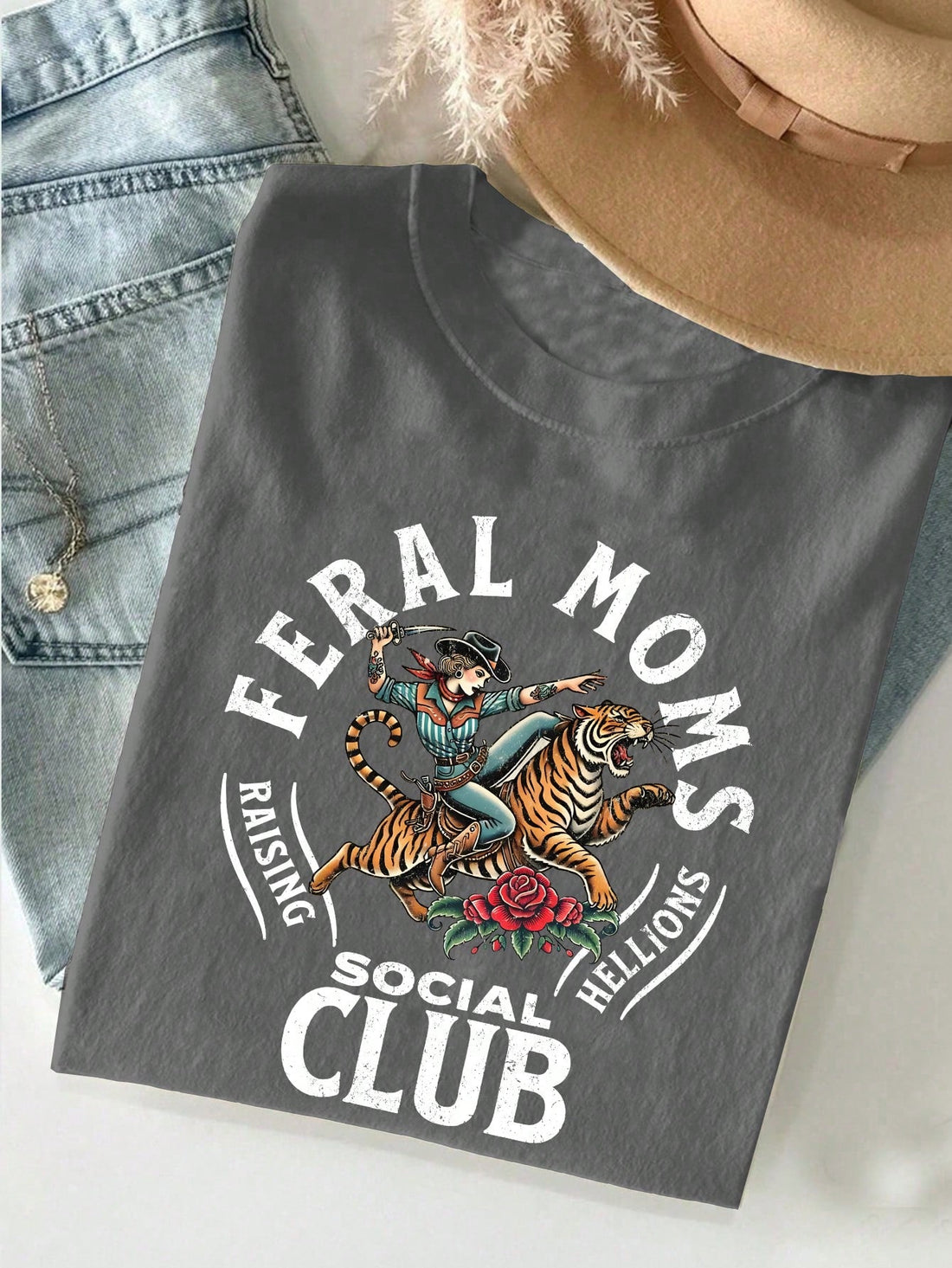 Join the Retro Wild Mom Social Club with this stylish t-shirt, perfect for any mom looking to add a fun twist to her wardrobe! Makes a great gift for the moms in your life who love to stand out with a touch of retro flair. Let's get wild, moms!