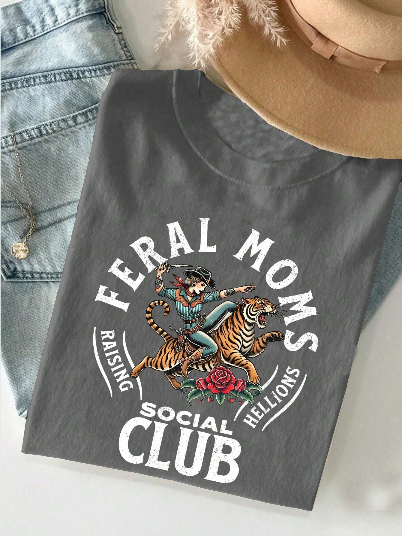 Join the Retro Wild Mom Social Club with this stylish t-shirt, perfect for any mom looking to add a fun twist to her wardrobe! Makes a great gift for the moms in your life who love to stand out with a touch of retro flair. Let's get wild, moms!