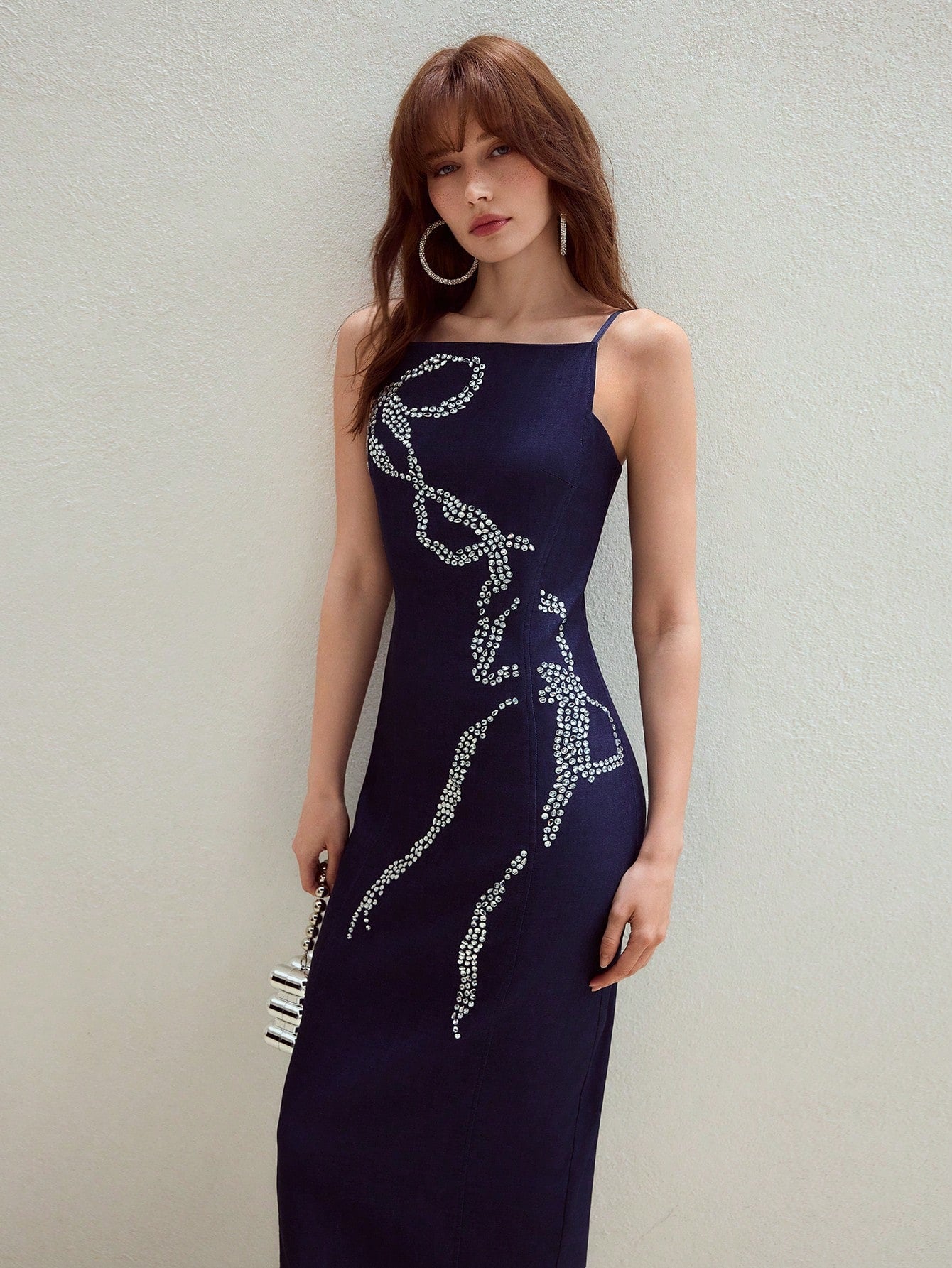Turn heads effortlessly in this Rhinestone Bowknot Slim Fit Cami Dress. Its sparkling bowknot detail adds a touch of glam, while the slim fit silhouette hugs your curves for a sleek, chic look. Perfect for nights out or special occasions, this dress brings playful elegance to your wardrobe.
