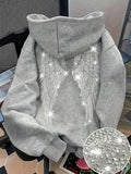Make a bold statement with this Rhinestone Wing Graphic Sweatshirt for Women, designed to blend edgy style with everyday comfort. Featuring a sparkling rhinestone wing graphic on a classic black pullover, this sweatshirt adds a touch of glam to your casual wardrobe. Crafted from soft, comfortable fabric with a relaxed fit, it's perfect for staying cozy while looking effortlessly stylish.