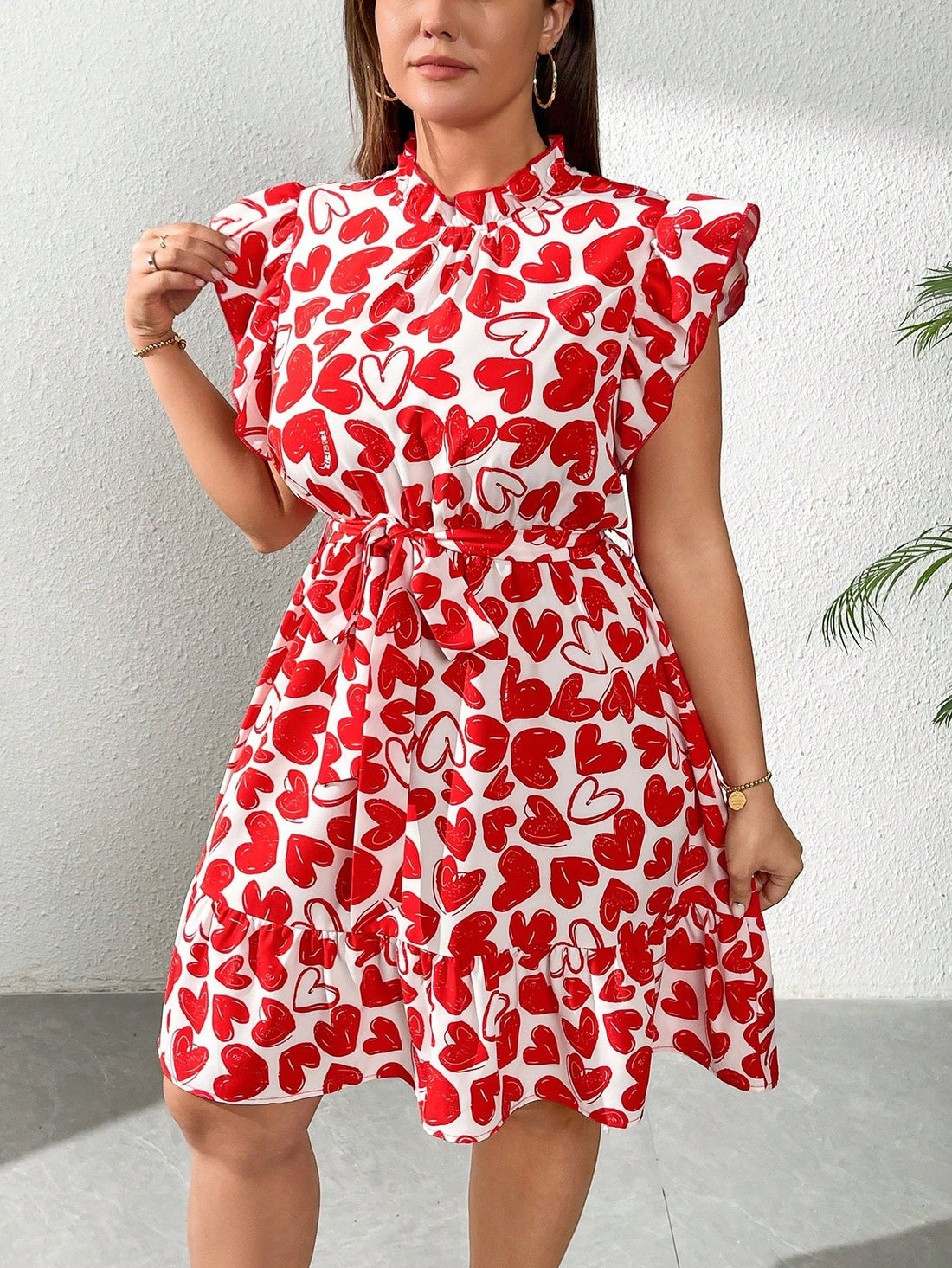 Embrace your playful side in this Romantic Plus Size Heart Print Flared Dress. With flutter sleeves that dance as you move and a flared silhouette that flatters every curve, it’s the ultimate choice for sunny spring days and warm summer nights. The charming heart print adds a touch of whimsy, making it perfect for picnics, dates, or casual outings where you want to feel effortlessly cute and confident.