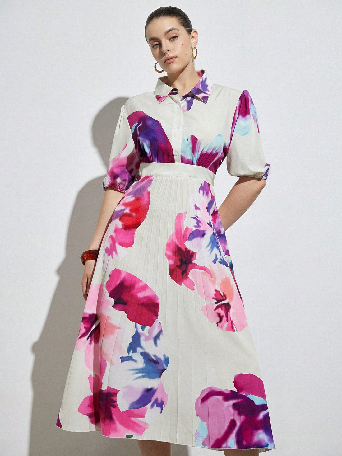 Step into timeless charm with this Romantic Vintage Plus Size Shirt Dress. Featuring a full print design, a classic collar, and an elasticized waist, it beautifully hugs your curves while the flared skirt adds a playful twirl to every step. Perfect for those who love vintage vibes with a fun, flattering fit.