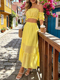 Elevate your spring and summer wardrobe with this enchanting yellow two-piece set. The romantic off-the-shoulder blouse features delicate puff sleeves, shirring, and playful ruffled details for effortless boho charm. Pair it with the flowing long skirt for a polished look perfect for weddings, formal events, or festive celebrations. Crafted from a breathable lyocell and polyamide blend, this slim-fit ensemble offers comfort and style. Machine washable for easy care.