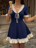 Navy blue ruffle tie-front skater mini dress in front café detail view