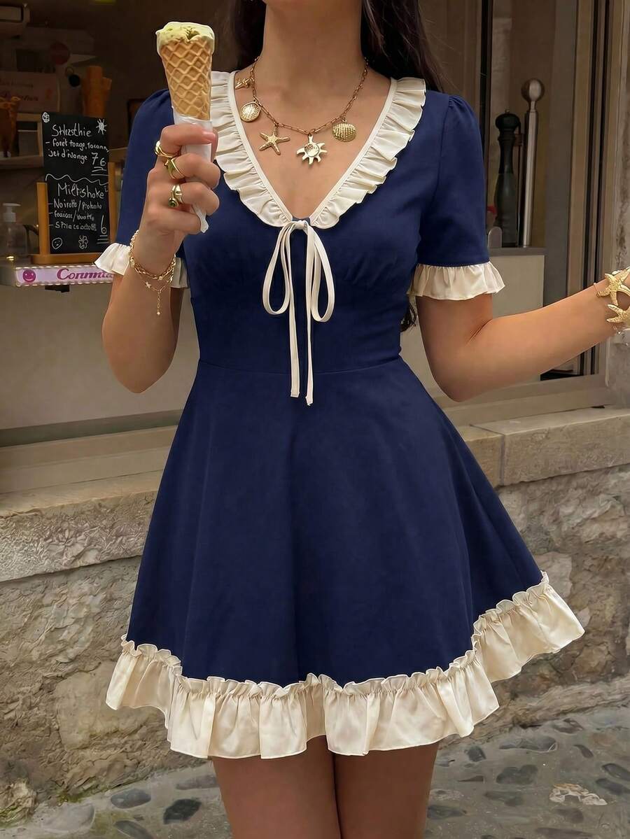 Navy blue ruffle tie-front skater mini dress in front café detail view