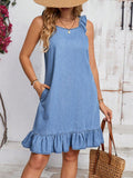Elevate your vacation style with our Ruffle Trim Sleeveless Denim Dress. Its ruffle trim adds a touch of femininity to the classic denim look, making it perfect for a stylish getaway. Crafted with comfort in mind, this dress will keep you looking and feeling great on your next vacation.