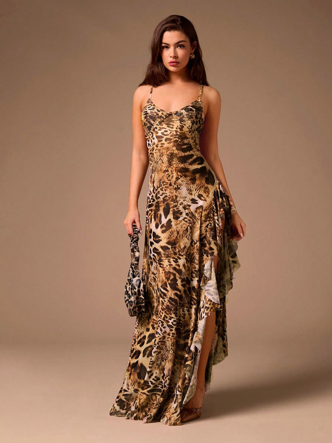 Embody retro glamour effortlessly with our Ruffled Leopard Mesh Maxi Dress. The high slit adds an alluring touch, while the ruffled detailing and mesh material add a touch of playfulness. Perfect for any occasion, this dress exudes elegance and boldness. (Rawr!)