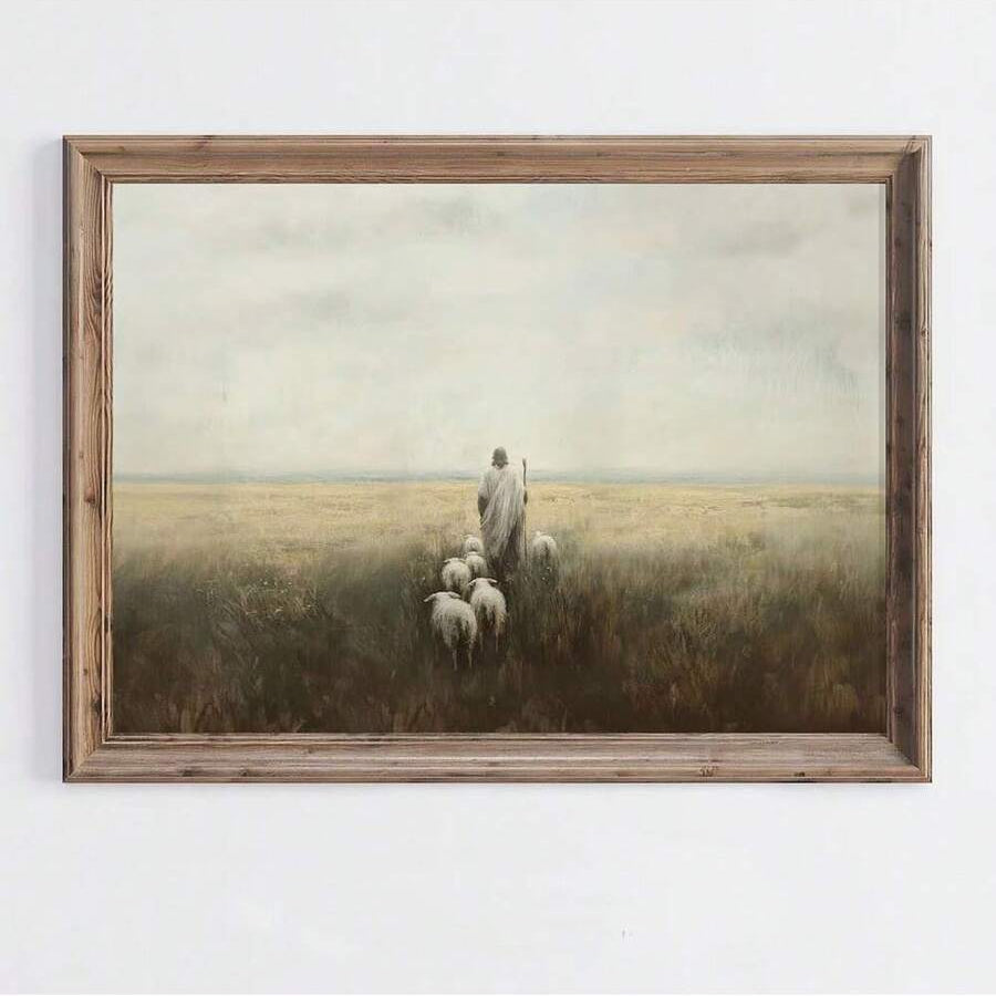 Rustic framed Jesus shepherd canvas wall art showing a robed figure and sheep in a muted grassland