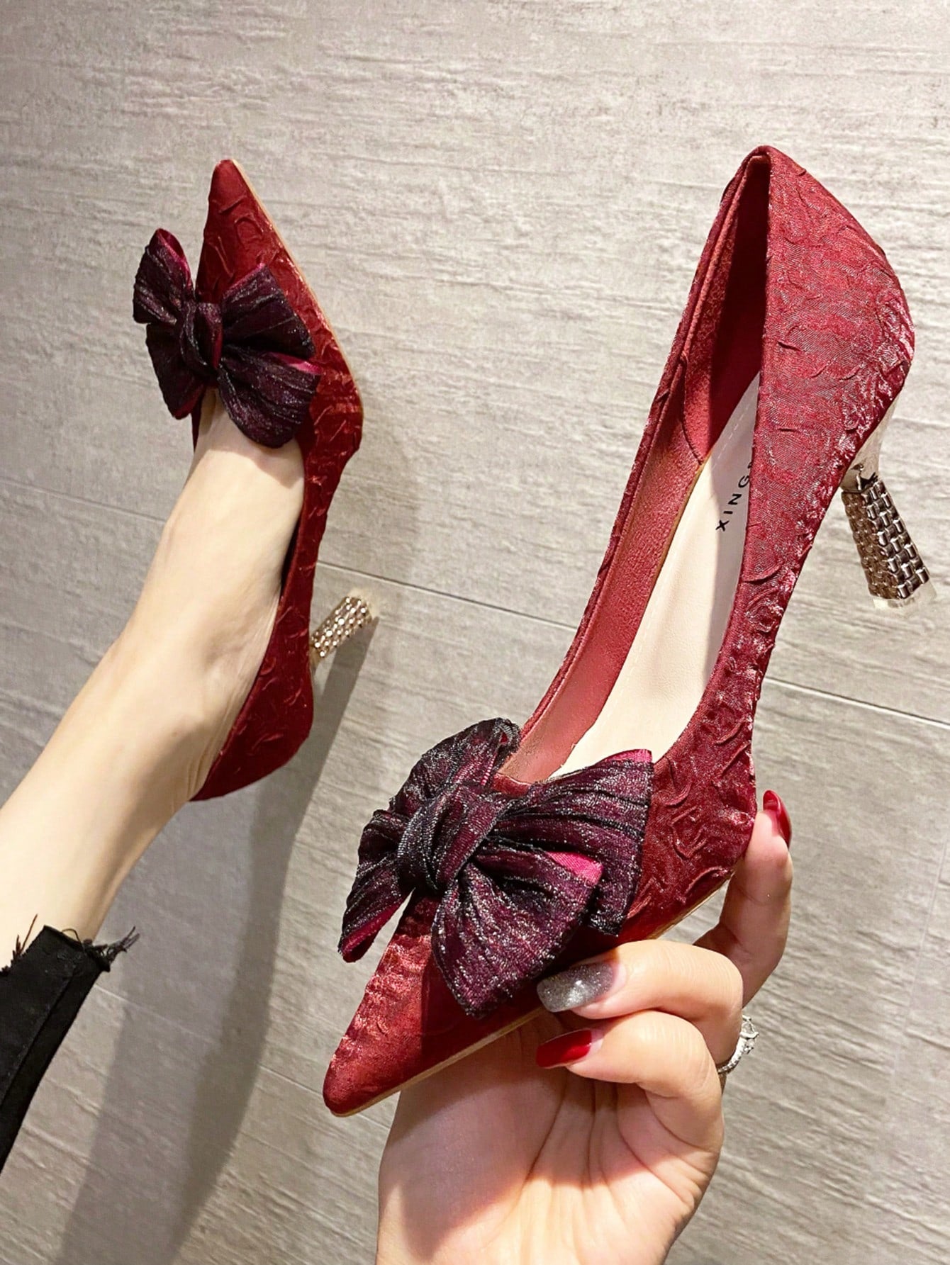 Sleek and sophisticated, the Satin Elegance pumps feature a stunning bow detail and a pointed toe design. With a stiletto heel, these pumps add a touch of elegance and confidence to your outfit. Expertly crafted with satin material for a luxurious look and feel. Perfect for any occasion.