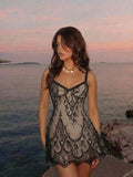 Black lace slip mini dress with nude beige lining and spaghetti straps