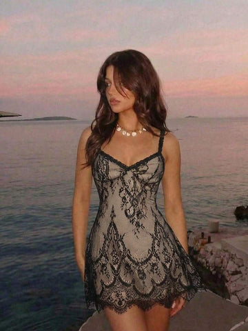 Black lace slip mini dress with nude beige lining and spaghetti straps