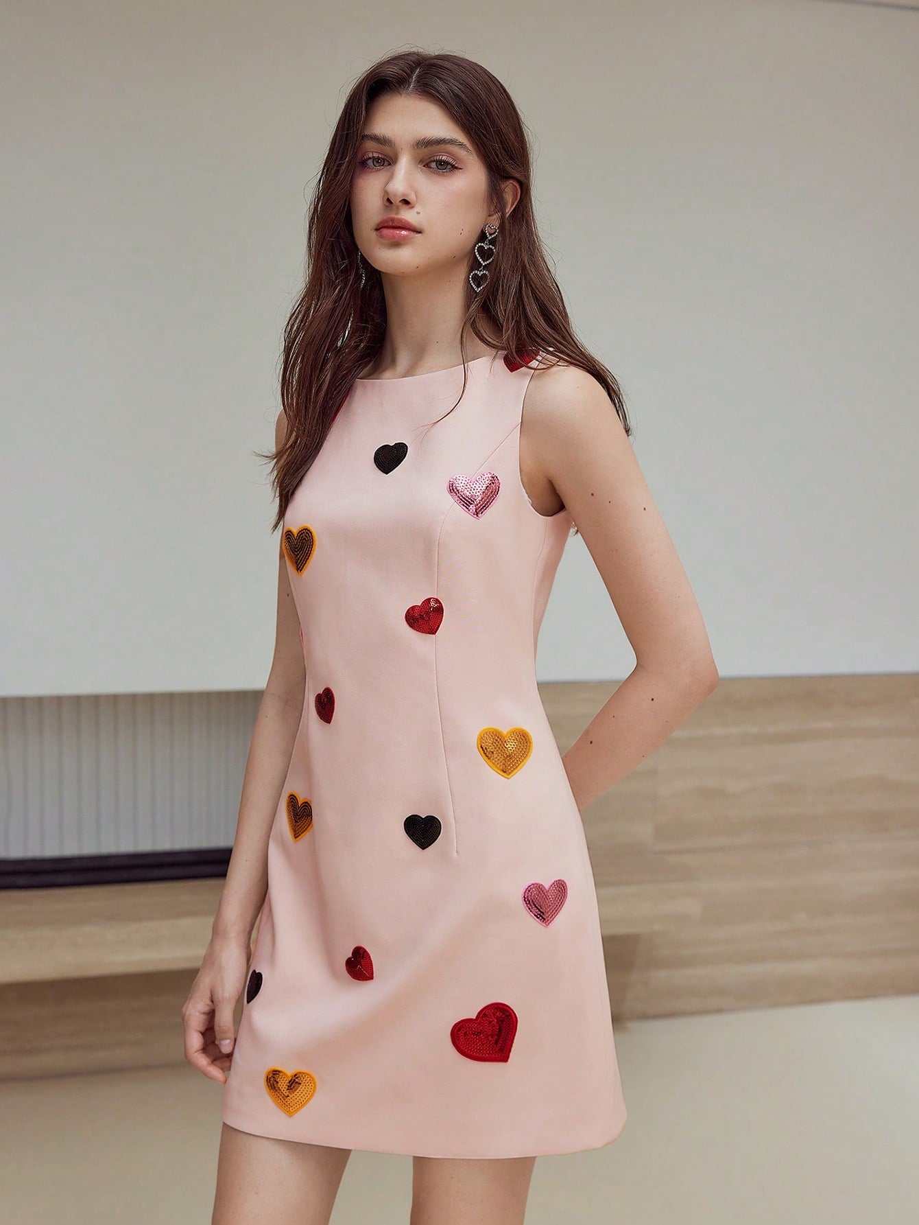 Turn heads and sparkle all night in the Sequin Heart Zipper Dress. This playful yet elegant evening wear features shimmering sequins and a charming heart-shaped zipper detail, perfect for adding a touch of fun to your dazzling look. Ideal for parties or special occasions, it combines style and sparkle effortlessly.
