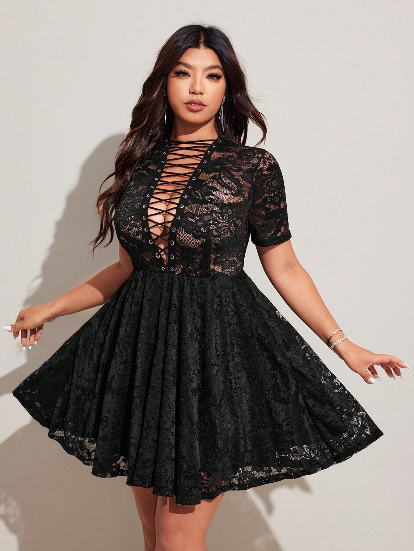 Step into the spotlight with this sheer A-line dress featuring a daring lace-up deep V neckline. Its flowing silhouette adds a touch of elegance, while the playful lace-up detail brings a flirty edge. Perfect for turning heads and embracing your glamorous side with confidence and fun.
