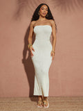 Turn heads this spring and summer with our Sheer Knit Strapless Bodycon Midi Dress. Its lightweight, breathable knit fabric keeps you cool while the strapless design adds a flirty touch. Perfect for vacations or sunny days out, this dress hugs your curves for a confident, playful look that’s as fun as your adventures.