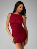 Unleash your free spirit with this bodycon mini dress! Made from sheer fabric, it features a shirred racerback design ideal for showing off your beach body. Perfect for lounging on the sand or dancing the night away. Life's a beach. (And you're the mermaid.)