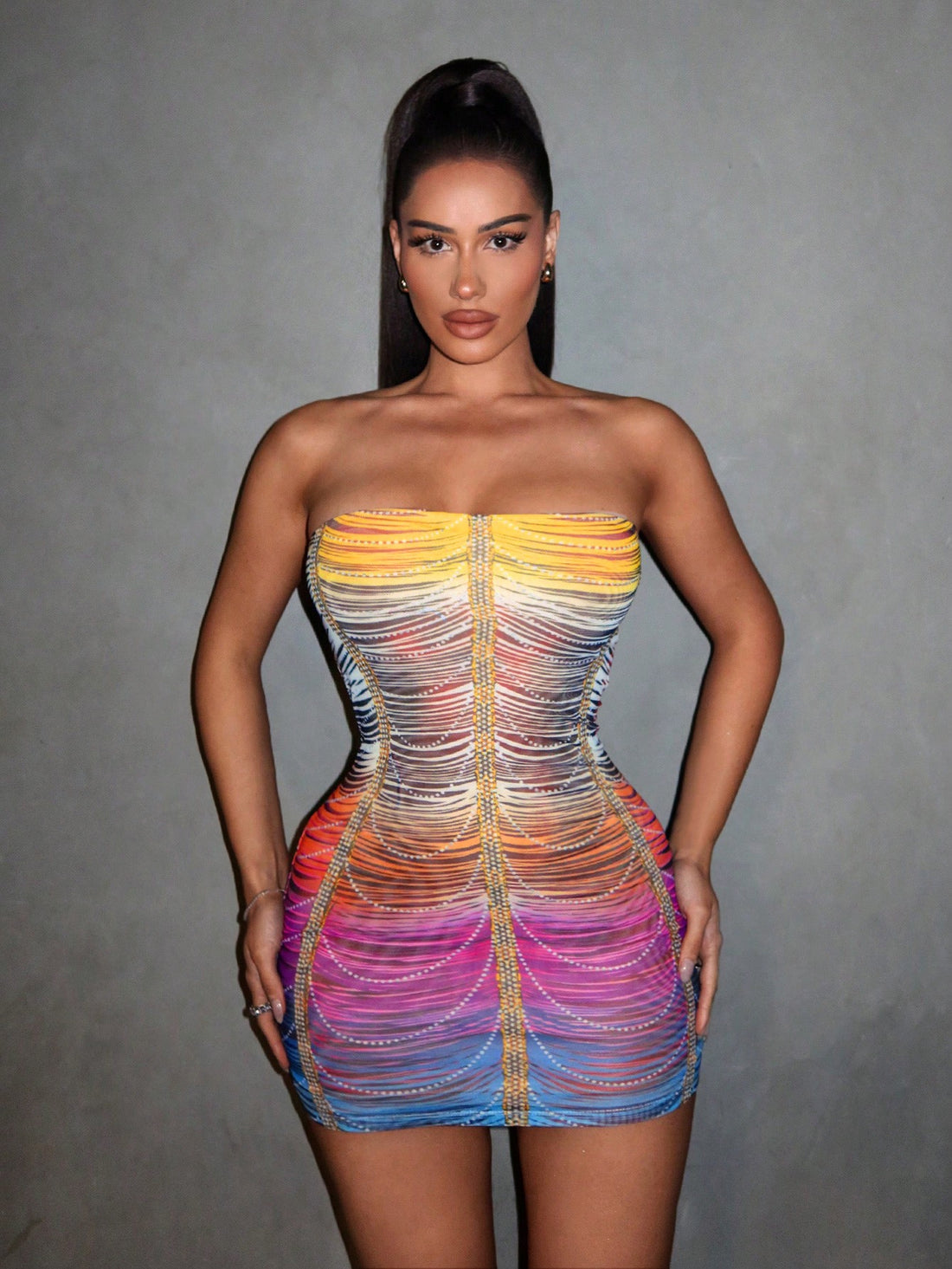 Shine bright and turn heads in our Rainbow Rhinestone Mesh Bodycon Dress! The perfect summer party outfit, this dress features sparkling rhinestones and a body-hugging fit. Stay stylish and comfortable all night long.