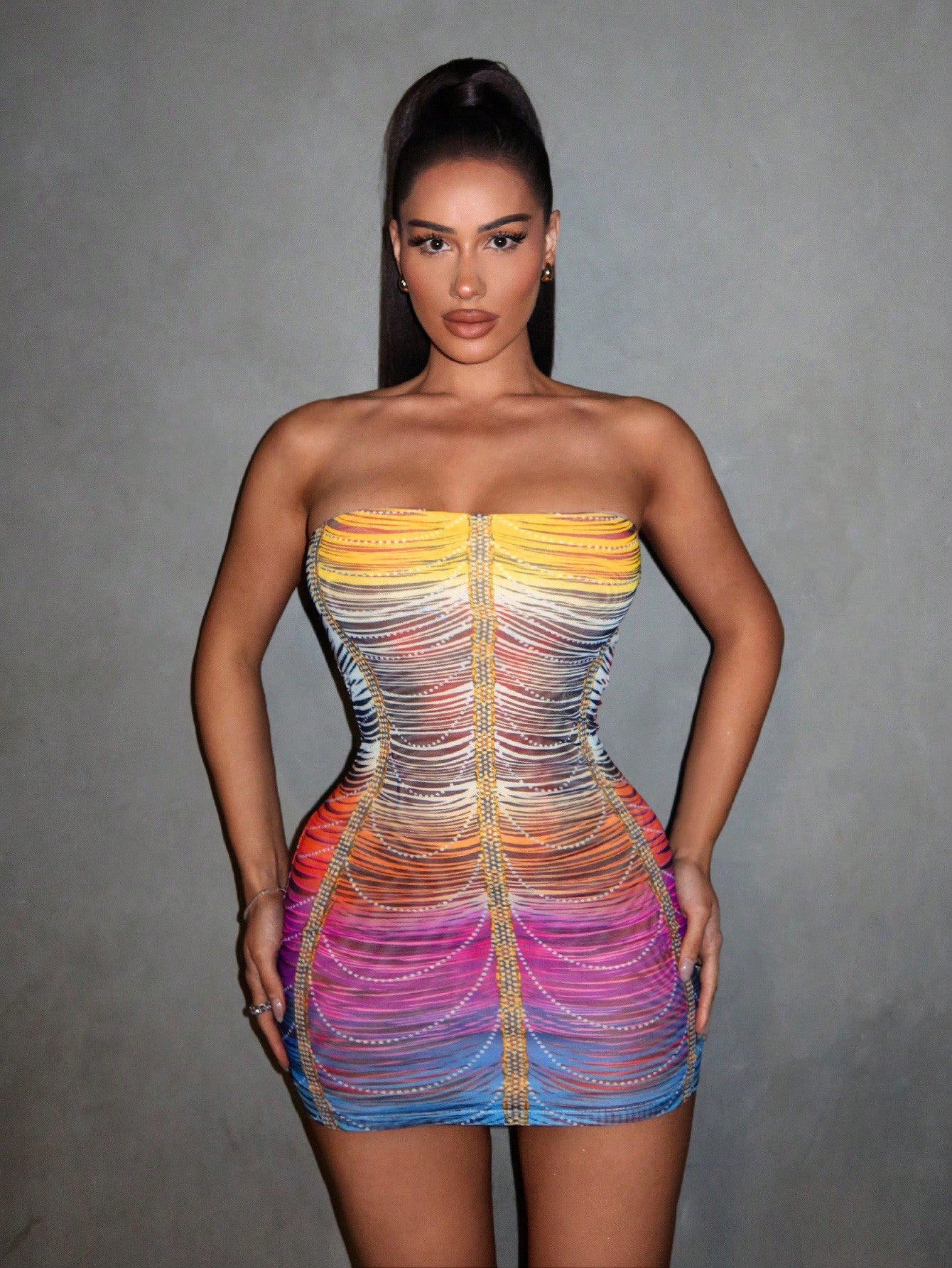 Shine bright and turn heads in our Rainbow Rhinestone Mesh Bodycon Dress! The perfect summer party outfit, this dress features sparkling rhinestones and a body-hugging fit. Stay stylish and comfortable all night long.