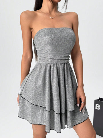 Discover the perfect dress for any occasion with our Shiny Ruffle Bandeau Mini Dress. Designed to be both chic and trendy, this dress will make you stand out in any crowd. The shiny fabric and ruffle detail add a touch of glamour, while the bandeau style shows off your shoulders. Elevate your fashion game and turn heads wherever you go!