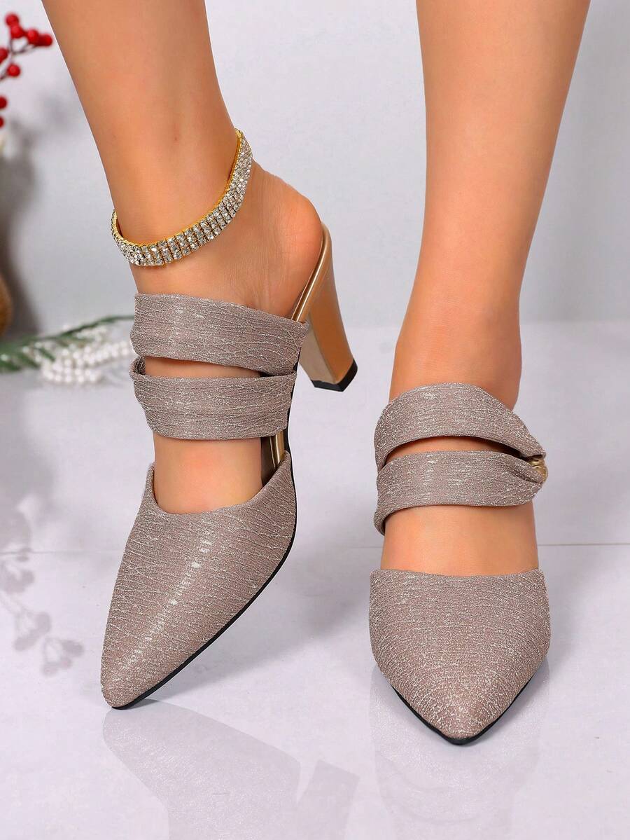 Step into effortless elegance with these shiny silver high heel mules, designed for the modern woman who values both style and comfort. The reflective metallic finish catches light beautifully, making them perfect for spring occasions from casual outings to evening events. The backless silhouette offers breathable wear during warmer months while the elevated heel elongates your leg line and adds instant sophistication to any outfit. Versatile enough to pair with dresses, skirts, or tailored pants, these mul