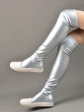 Enhance your casual look with these shiny silver thigh-high boots. With their sleek design and eye-catching color, these boots will elevate your style and make you stand out from the crowd. Featuring a thigh-high length, they provide comfort and style all in one. 