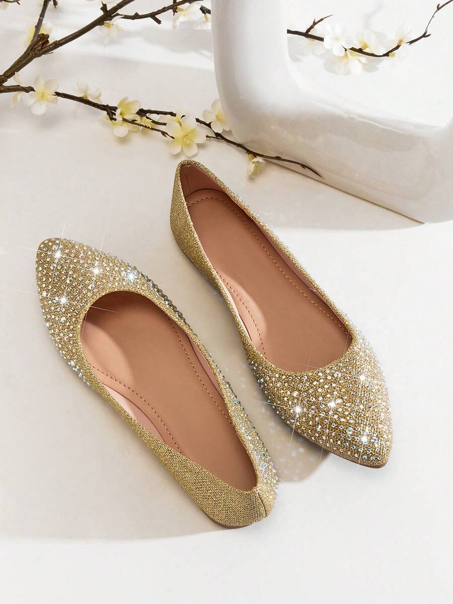 # Elegant Women's Rhinestone Flats: Ultimate Comfort with Round Toe Design Crafted for the discerning woman who refuses to compromise between style and comfort, these rhinestone-embellished flats feature a thoughtfully designed round toe that accommodates natural foot shape while reducing pressure points. The sparkling rhinestone detailing elevates any ensemble from casual to sophisticated, making these versatile enough for both professional settings and social occasions. The flat sole provides stable, all-