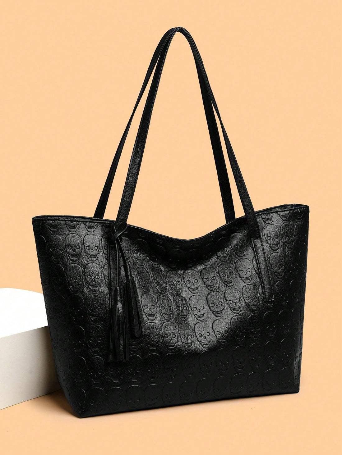 This Skull Gothic Style Tassel Shoulder Tote is perfect for a versatile and fashionable outing bag. The tassel detail adds a touch of edginess, while the shoulder strap allows for easy transportation. Made with high-quality materials, this tote is durable and stylish, making it an ideal choice for any outing.
