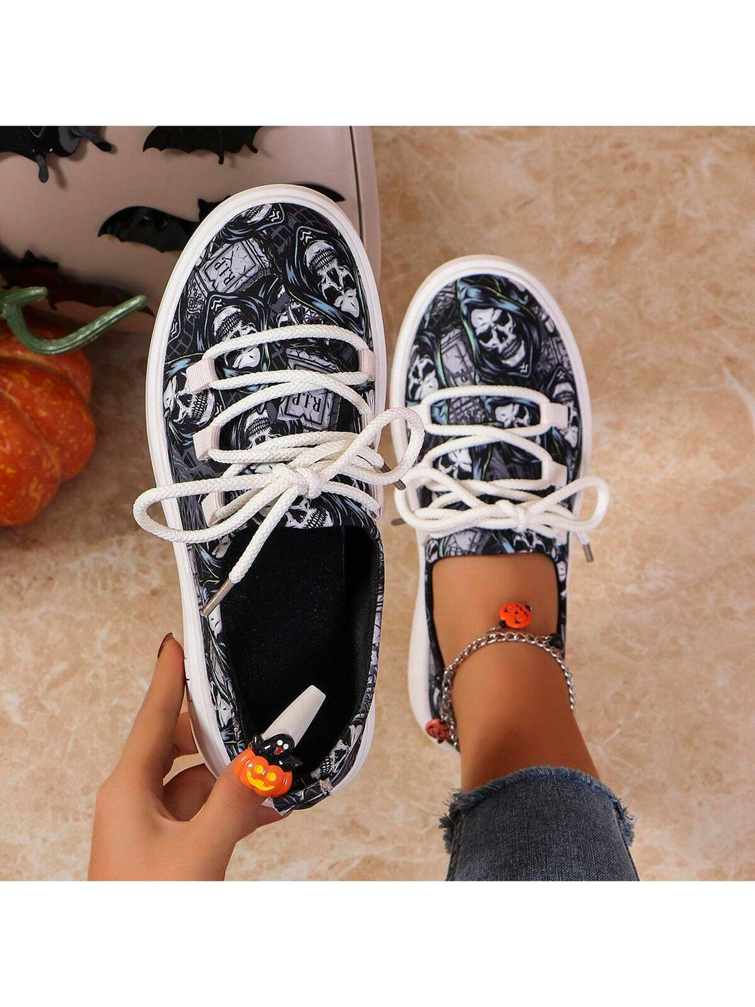Step up your Halloween footwear game with our Skull Print Lace-Up Sneakers. These stylish sneakers are perfect for adding a spooky touch to any outfit. Featuring a trendy lace-up design and a bold skull print, these shoes are the perfect choice for Halloween 2024.