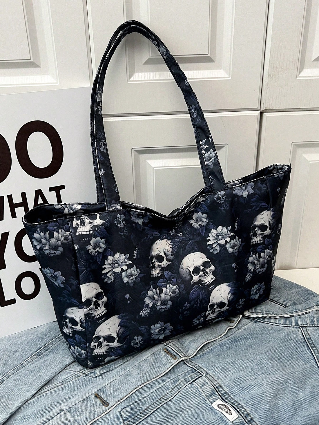 Designed for ultimate versatility, the Skull Shoulder Tote is perfect for school, work, and shopping. The vintage canvas material adds a touch of style, while the spacious interior and sturdy shoulder straps make it ideal for carrying all your essentials. Stay fashionable and functional with this must-have tote.
