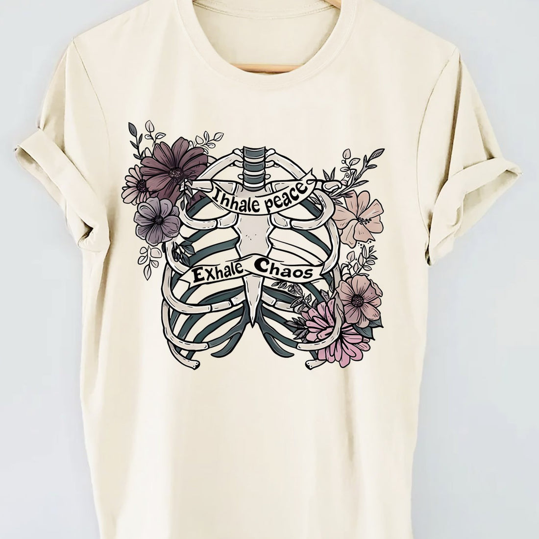 Introducing our Skull and Floral Fusion top, perfect for a casual look with short sleeves. Embrace your edgy side with the skull design while still staying feminine with the floral fusion. This top is a unique balance of style and comfort, making it a must-have for any fashion-forward woman.