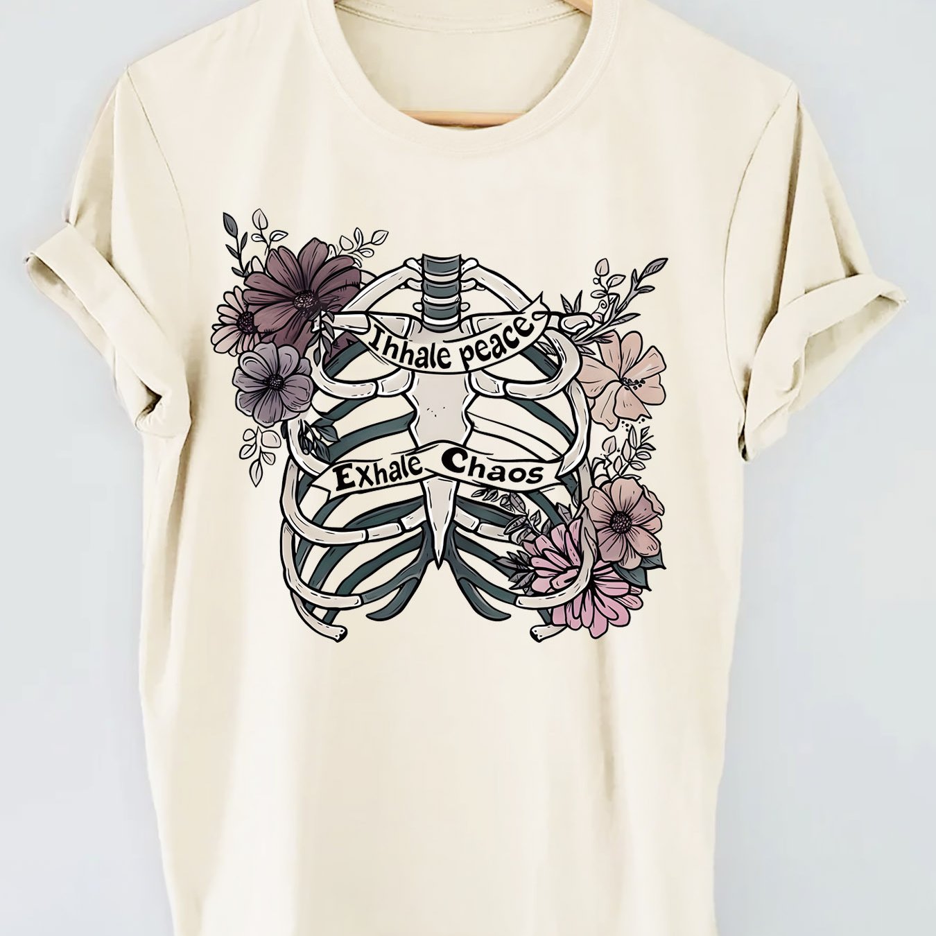 Introducing our Skull and Floral Fusion top, perfect for a casual look with short sleeves. Embrace your edgy side with the skull design while still staying feminine with the floral fusion. This top is a unique balance of style and comfort, making it a must-have for any fashion-forward woman.
