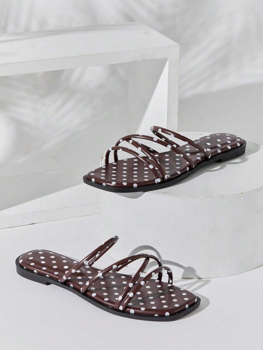 Step into summer with confidence in these sleek square toe slide sandals. The multi-strap design offers secure support while maintaining a modern, minimalist aesthetic perfect for any warm-weather occasion. Crafted for comfort and style, these versatile sandals transition effortlessly from casual outings to relaxed social gatherings. The structured square toe silhouette flatters the foot while the smooth slide construction makes them easy to slip on and off. 