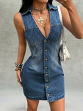 Front angled view of medium-wash button-front denim mini dress with pointed collar