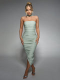 Elevate your style with our Slinky Ruched Asymmetrical Hem Midi Dress. Designed for chic and effortless style, this dress is perfect for any occasion. The ruched detailing adds a touch of playfulness, while the asymmetrical hem creates a unique and eye-catching look. You'll feel confident and comfortable all day long in this versatile and flattering dress. Don't settle for ordinary, stand out with our Slinky Ruched Asymmetrical Hem Midi Dress!