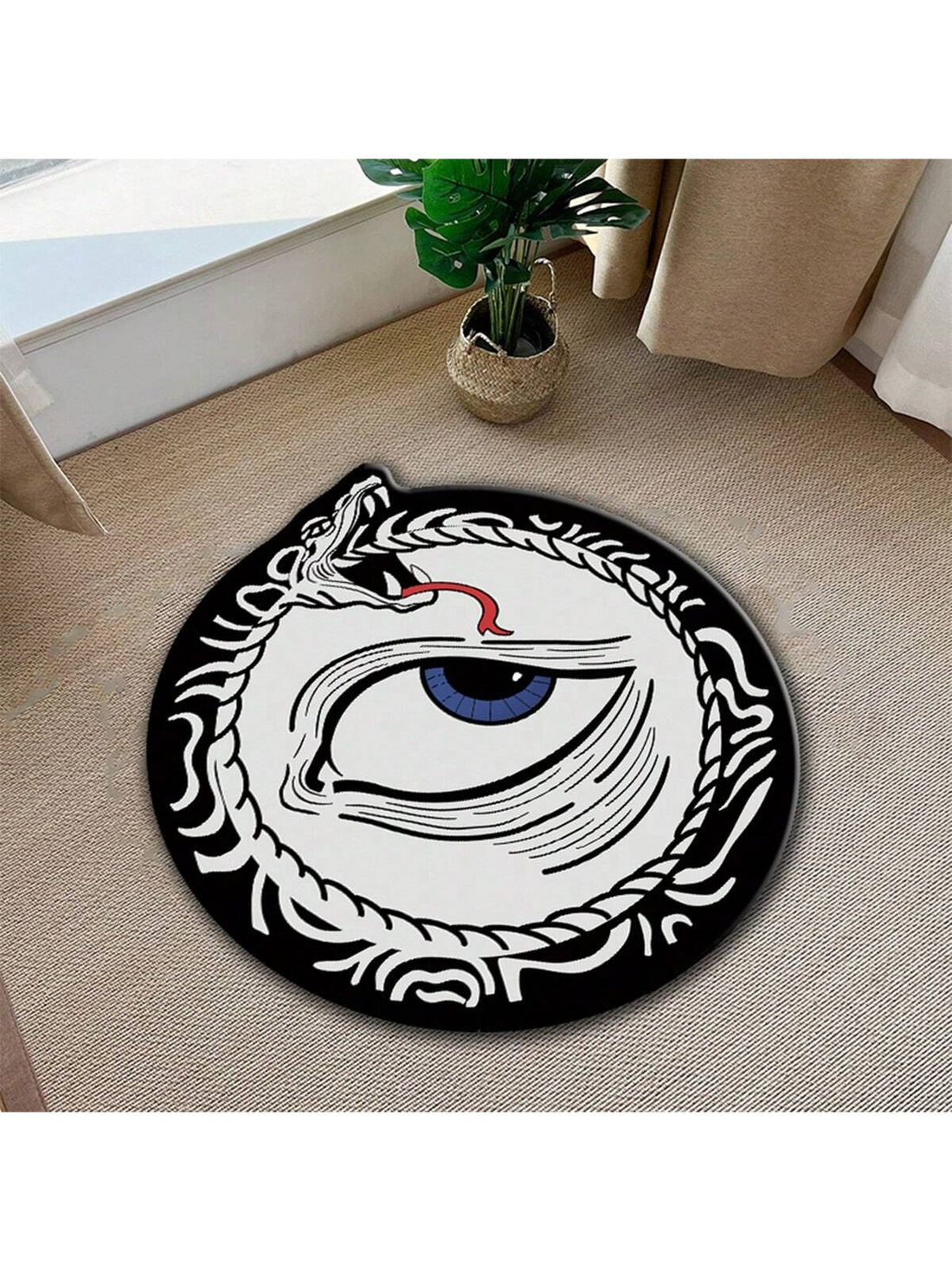 Elevate the look of your home with our Snake Eye Printed Round Carpet. Designed with a funny and eye-catching style, this decorative rug adds a unique touch to any room. Made with high-quality materials, it offers both comfort and durability. Transform your space with this must-have addition.