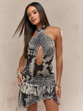 Show off your wild side in this sexy snake print dress. The backless design and cross halter neck add a daring touch, while the cut-out detail and ruffle hem add a playful twist to this bodycon mini. You'll be the talk of the party in this dress (and not just because of the print)!