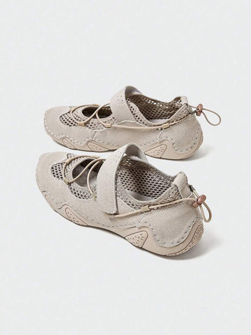 Rear-top view of beige mesh water shoes with hook-and-loop strap and patterned rubber sole