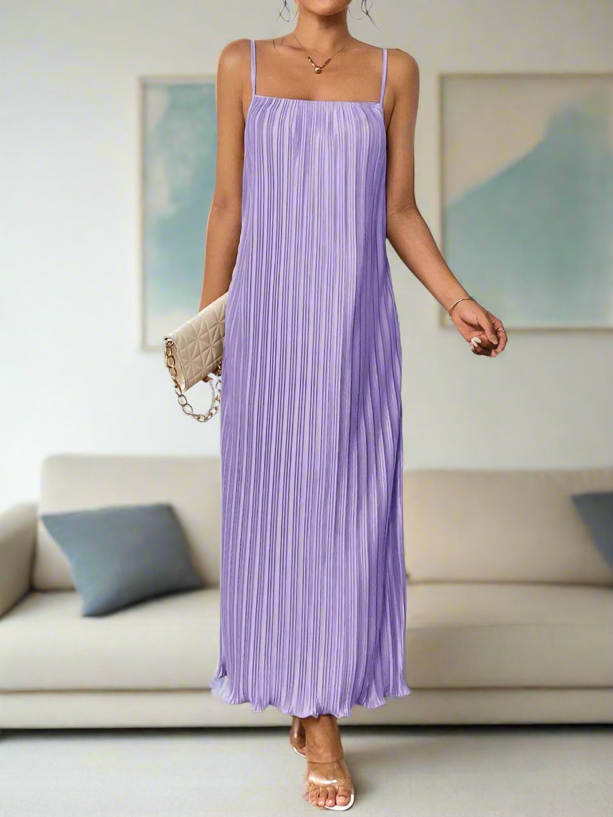 This solid purple color cami dress is the perfect addition to your summer wardrobe. With its versatile style and eye-catching color, it's sure to make a statement wherever you go. Made from high-quality materials, this dress offers both comfort and durability. Elevate your summer style with this must-have dress.