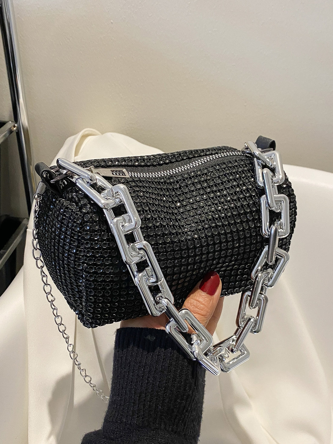 Experience the ultimate in glamour and sophistication with the Sparkle and Shine Bucket Bag! Perfect for any glamorous evening, this bag combines style and functionality with its shimmering design and spacious interior. Don't be without the party essential that will surely turn heads.