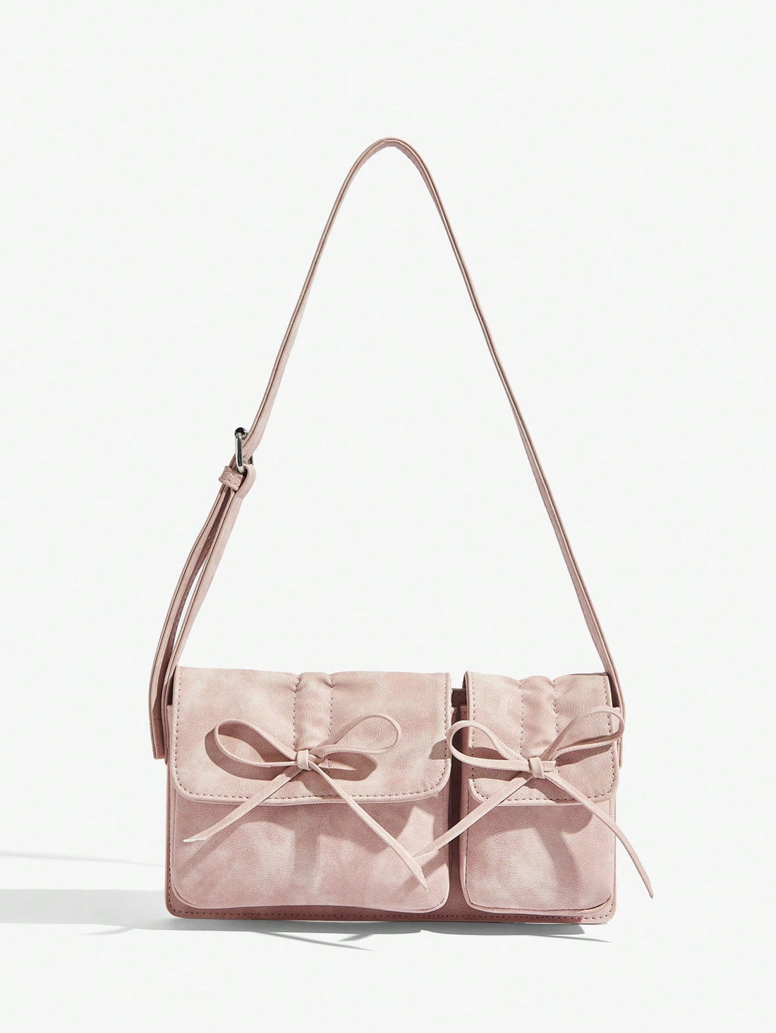 Elevate your Valentine's Day look with our Sparkle and Shine Rhinestone Bow Shoulder Bag. Its shimmering design and elegant rhinestone bow add a touch of glamour to any outfit. Perfect for a romantic night out or a fancy dinner, this bag is sure to turn heads and make a statement.