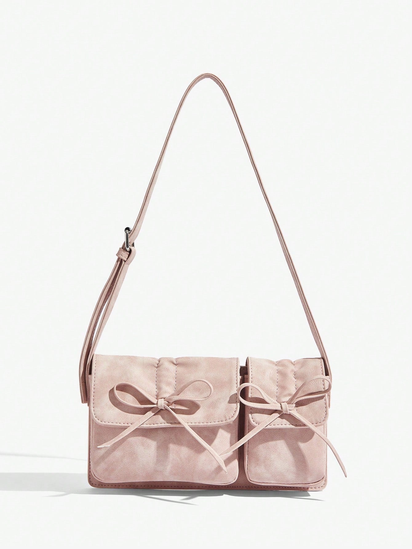 Elevate your Valentine's Day look with our Sparkle and Shine Rhinestone Bow Shoulder Bag. Its shimmering design and elegant rhinestone bow add a touch of glamour to any outfit. Perfect for a romantic night out or a fancy dinner, this bag is sure to turn heads and make a statement.