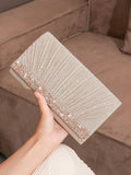 Make a statement with the luxurious Glitter Handbag! Perfect for party girls and brides, this ultimate clutch adds a touch of sparkle and shine to any outfit. The perfect accessory for any special occasion, this bag is a must-have for those who want to stand out.