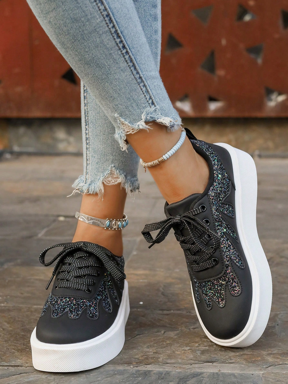 Step into style with our Women's Glitter Lace-Up Sneakers! These dazzling kicks combine eye-catching sparkle with cloud-like comfort thanks to their thick, cushioned soles. Perfect for adding a touch of glamour to your everyday outfits, these playful sneakers will have you dancing through your day while turning heads. Who says comfort can't be fabulous?