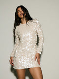 Turn heads effortlessly in this Sparkling Elegance sequin mini dress. With its long sleeves and dazzling sequins, it's perfect for lighting up any night out. Flirty, fun, and designed to make you shine, this dress brings festive glamour wherever you go.