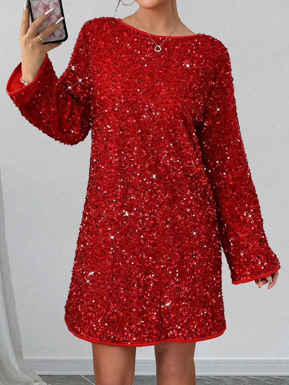 Get ready to shine at any festive occasion with our Sparkling Elegance: Sequin Bow Mini Dress! Covered in glittering sequins and adorned with a playful bow, this dress will make you the center of attention. Perfect for adding a touch of fun and glamour to any celebration.
