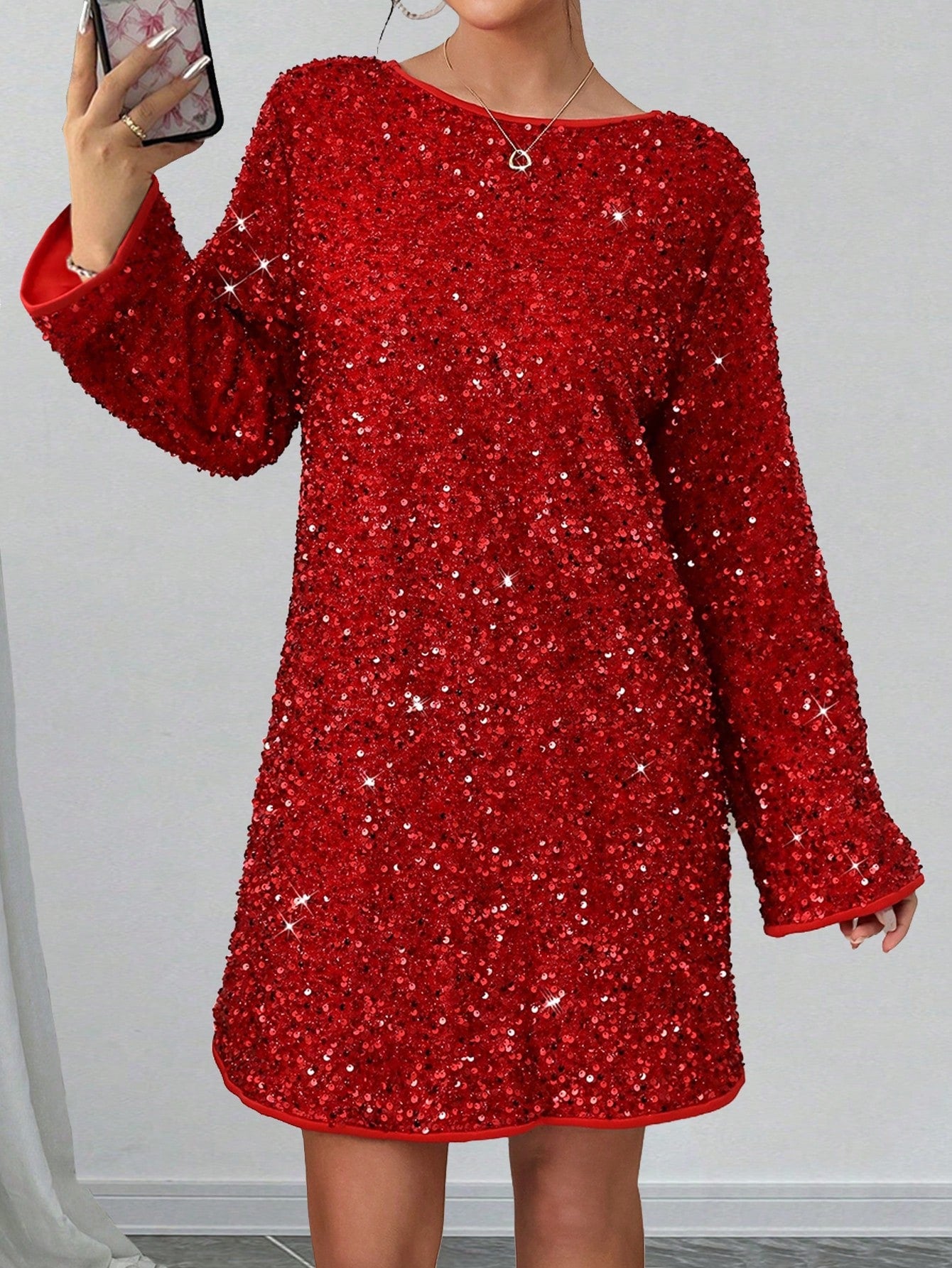 Get ready to shine at any festive occasion with our Sparkling Elegance: Sequin Bow Mini Dress! Covered in glittering sequins and adorned with a playful bow, this dress will make you the center of attention. Perfect for adding a touch of fun and glamour to any celebration.